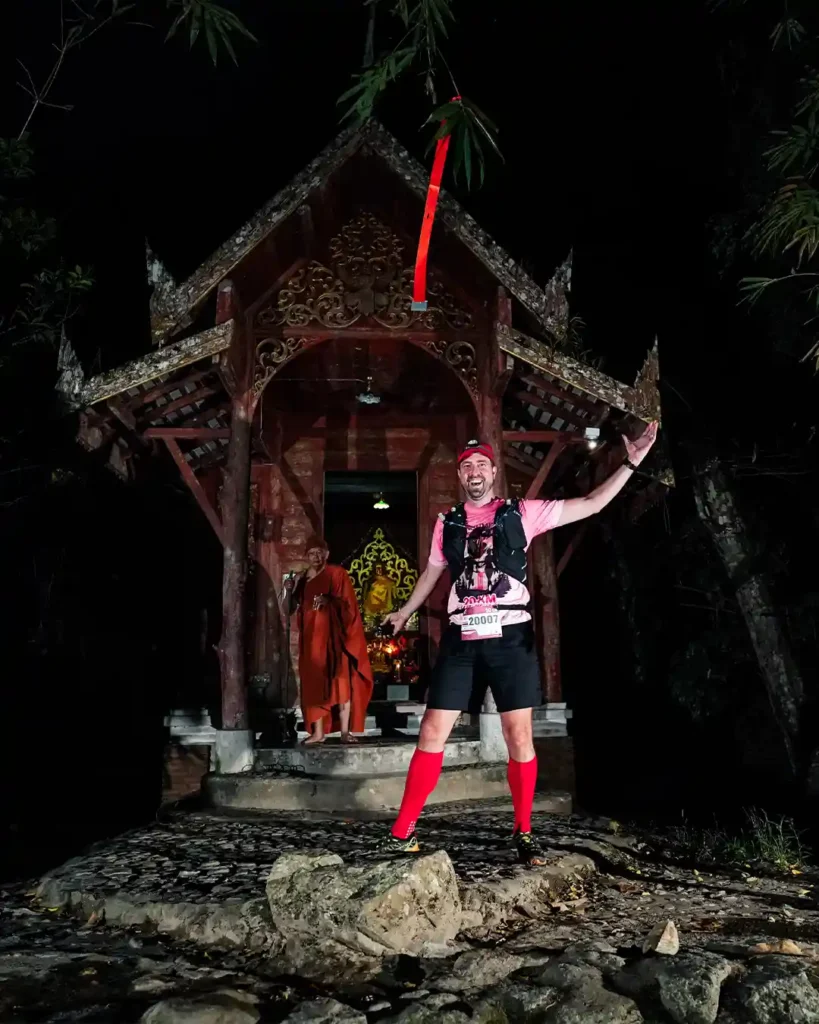 Posing in front of a mini-temple in Mae Kampong